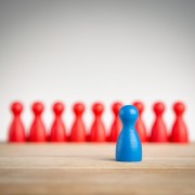 Stand out and be unique - leadership business concept with pawns